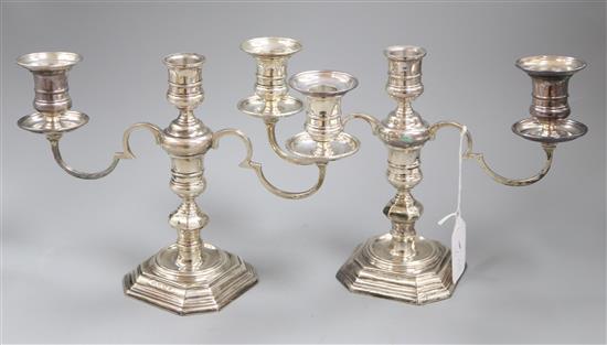 A pair of 1960s silver three light two branch dwarf candelabra by Elkington & Co, Birmingham, 1968, weighted.